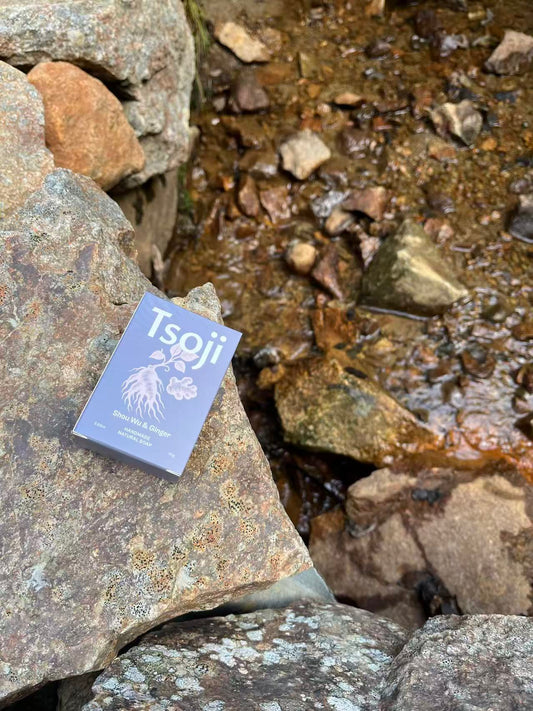 Tsoji-shou wu-ginger-handmade-natural-soap-on-rocks-next-to-a-stream